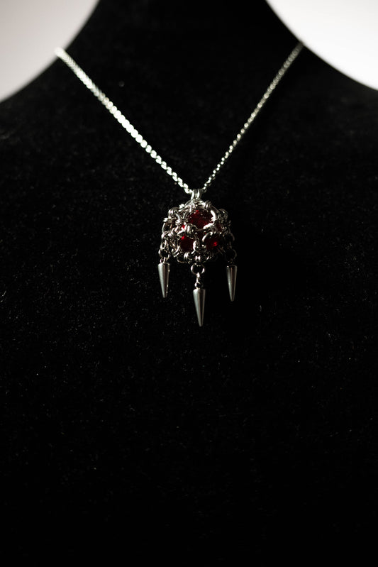 Collier Pendentif Perle pique rouge